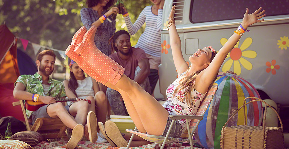 Carefree hipster having fun on campsite at a music festival